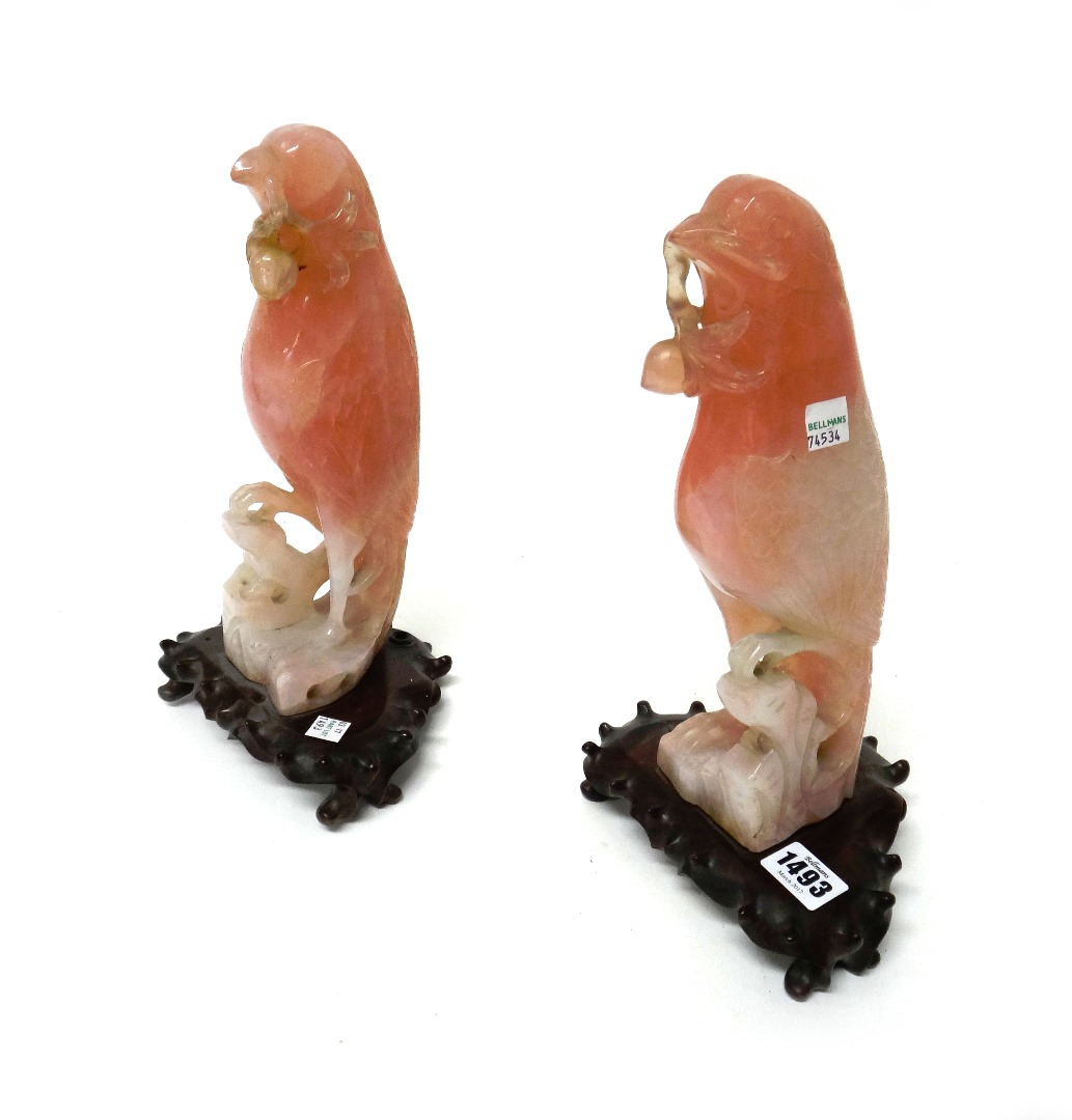 Appraisal: A pair of Chinese rose quartz figures of parrots late