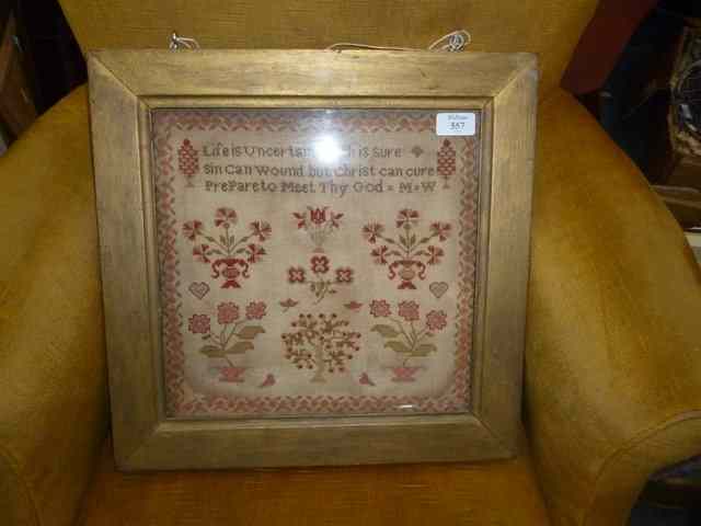 Appraisal: A VICTORIAN SAMPLER with flowers and motto within a banded