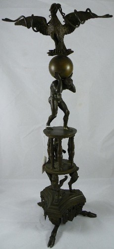 Appraisal: METAL FIGURE OF ATLAS SUPPORTING THE WORLD with eagle crest