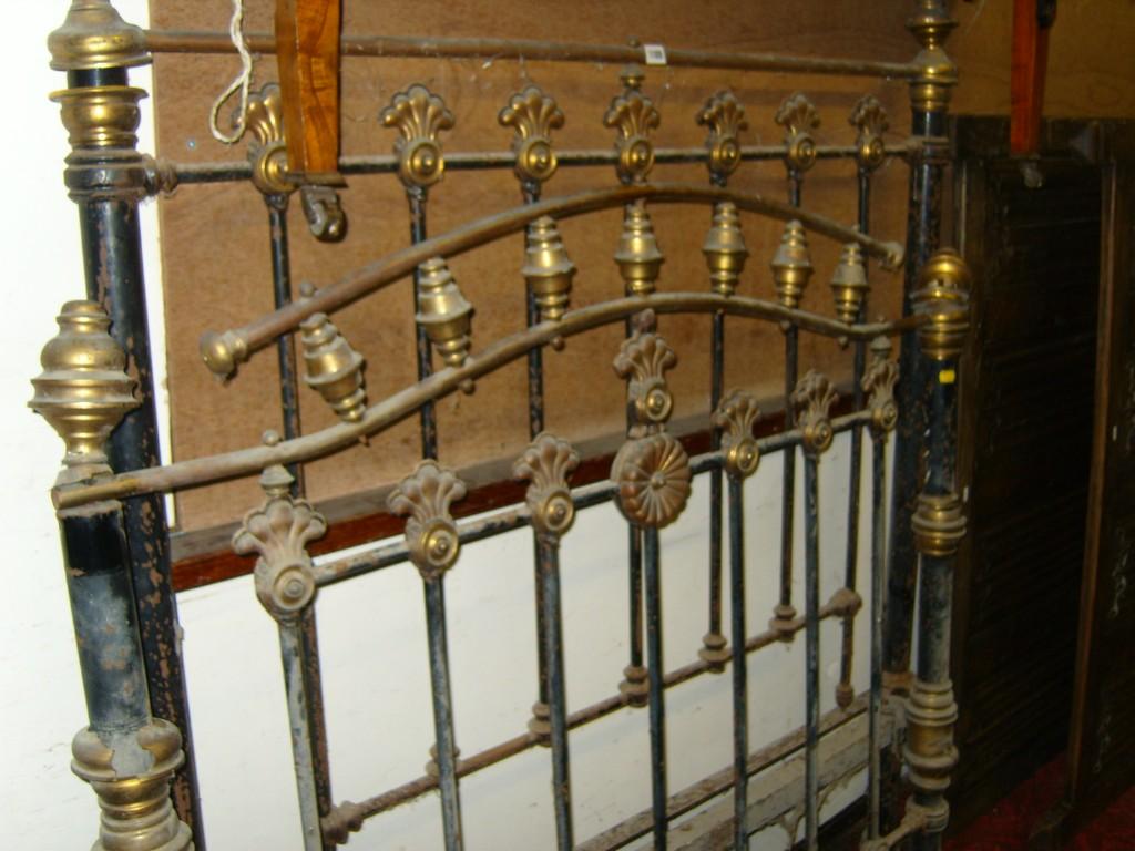 Appraisal: A Victorian brass and iron double bedstead with simple turned