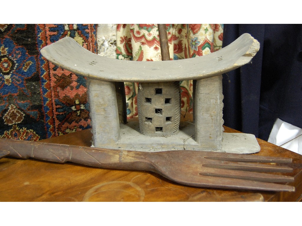 Appraisal: African tribal carved wood stool a war axe assegai spear