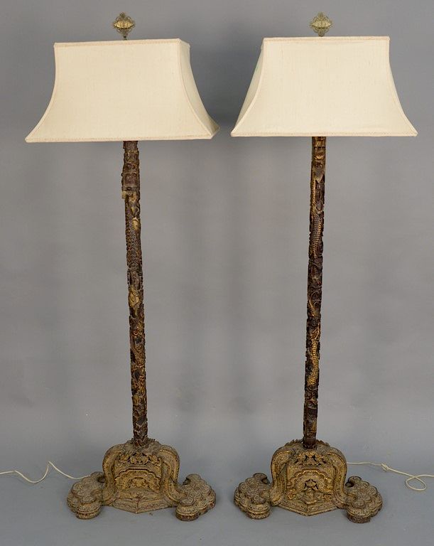 Appraisal: Pair of carved Chinese floor lamps having a carved dragon