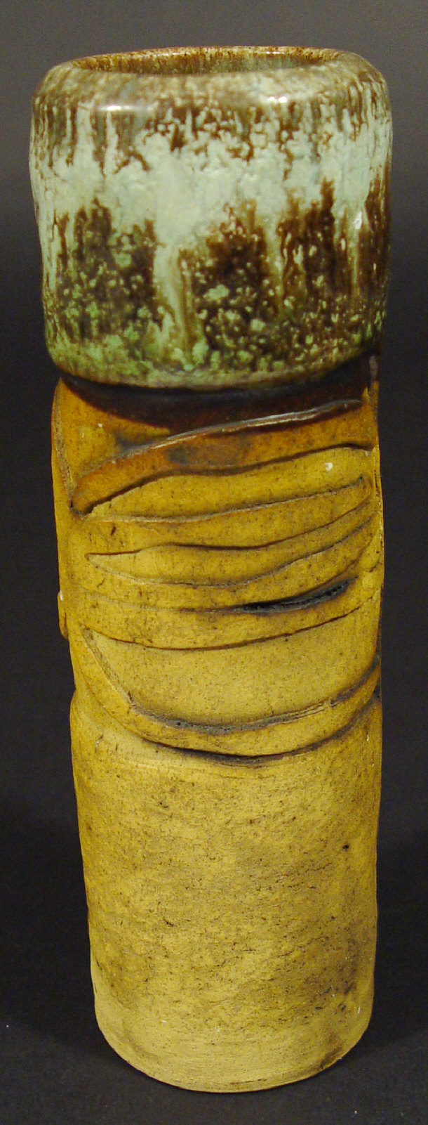 Appraisal: Cylindrical Studio stoneware vase with relief moulded and glazed decoration