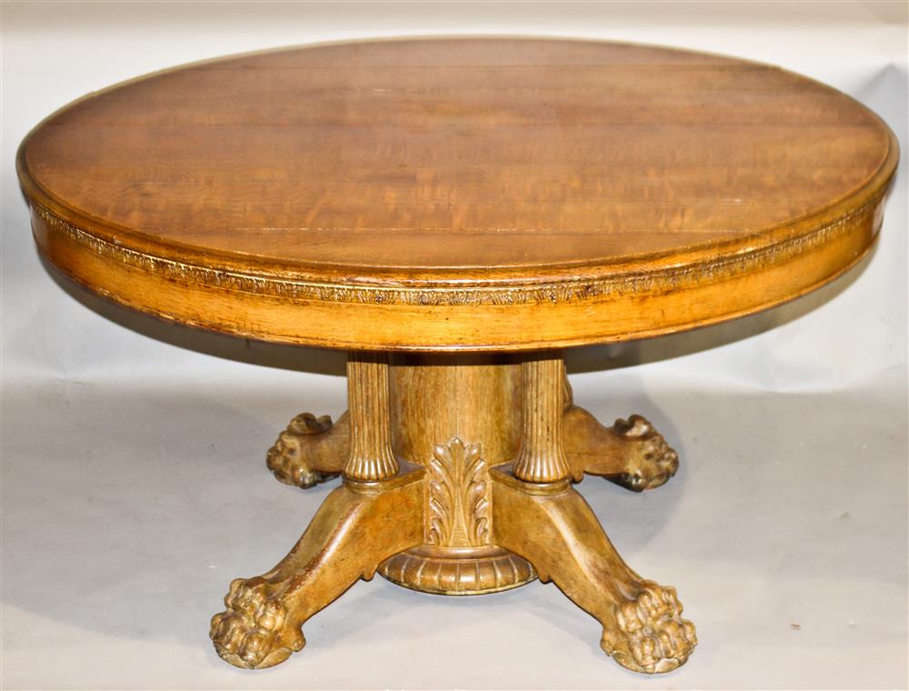 Appraisal: CARVED OAK ROUND CLASSICAL STYLE DINING TABLE having a round