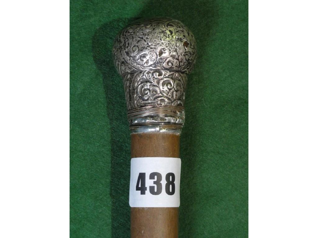 Appraisal: A gentleman's walking cane with a silver incised knop