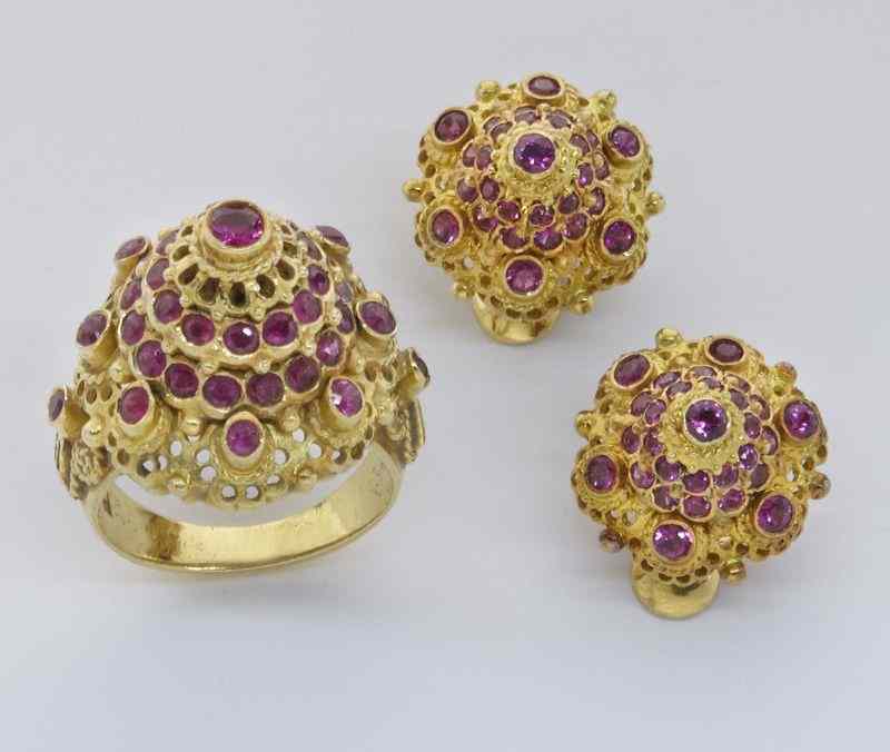 Appraisal: K gold and ruby ring with matching earrings the rubies