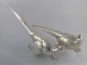 Appraisal: A pair of white metal pheasants marks unattributed tests silver