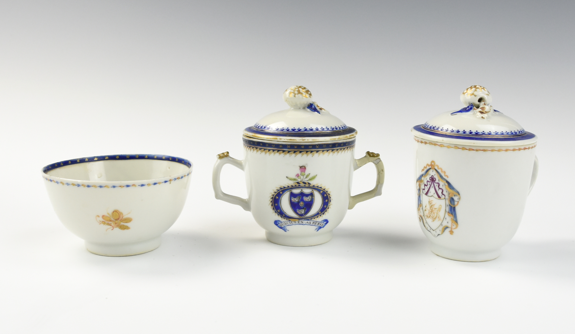 Appraisal: THREE CHINESE ARMORIAL EXPORT COVERED CUPS TH C Chinese th