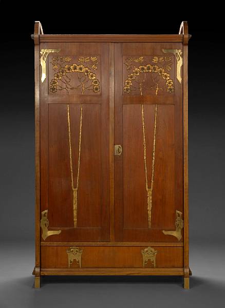 Appraisal: A Continental Secessionstil brass mounted parcel gilt carved mahogany wardrobe