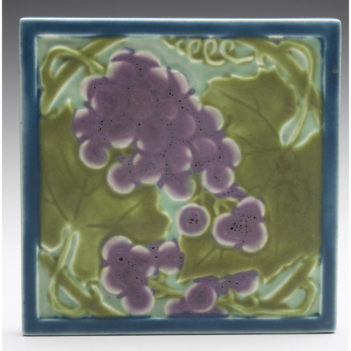 Appraisal: Rookwood trivet grape design with a blue border ''sq ground