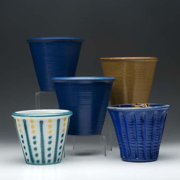 Appraisal: MARBLEHEAD Five flower pots three blue one cracked one with