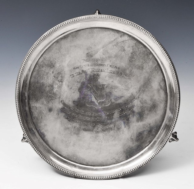 Appraisal: A VICTORIAN SILVER SALVER with beaded edge and three ball