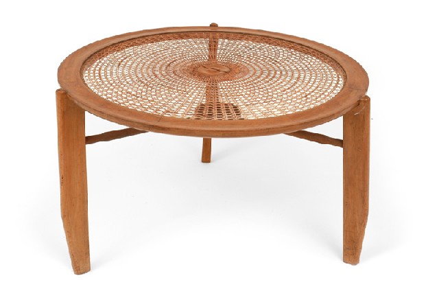 Appraisal: A CANED TEAK OCCASIONAL TABLE Circa The circular cane inset