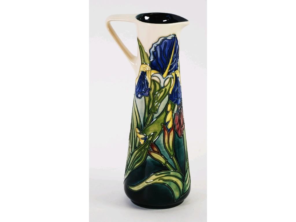 Appraisal: MODERN MOORCROFT TUBE LINED POTTERY JUG of a tall tapering