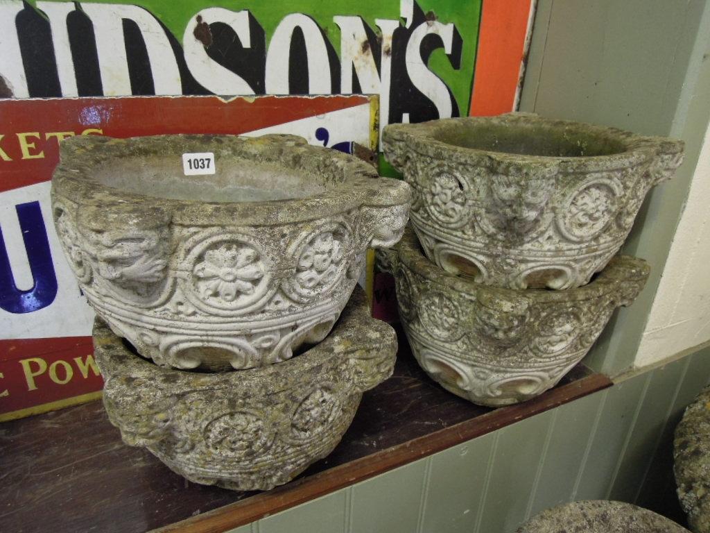 Appraisal: A set of four small weathered composition stone planters of