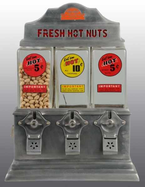 Appraisal: Fresh Hot Nuts Challenger -Cent Dispenser Description Three individual coin-op