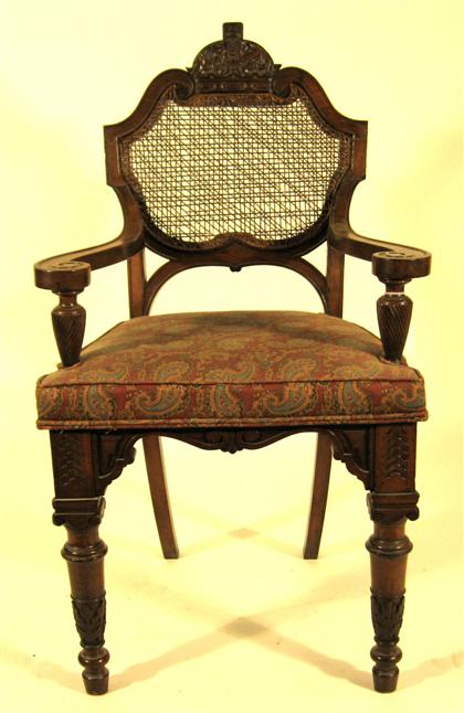 Appraisal: Charles X carved walnut caned back armchair H in