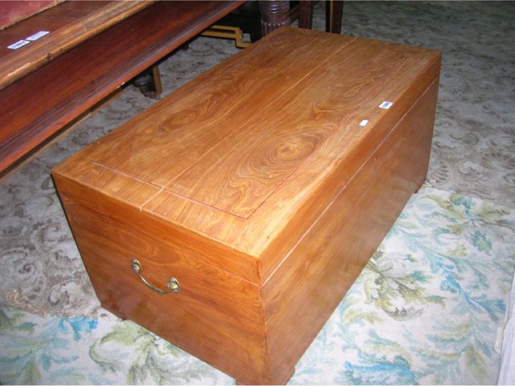 Appraisal: A teak wood blanket box of rectangular form with hinged