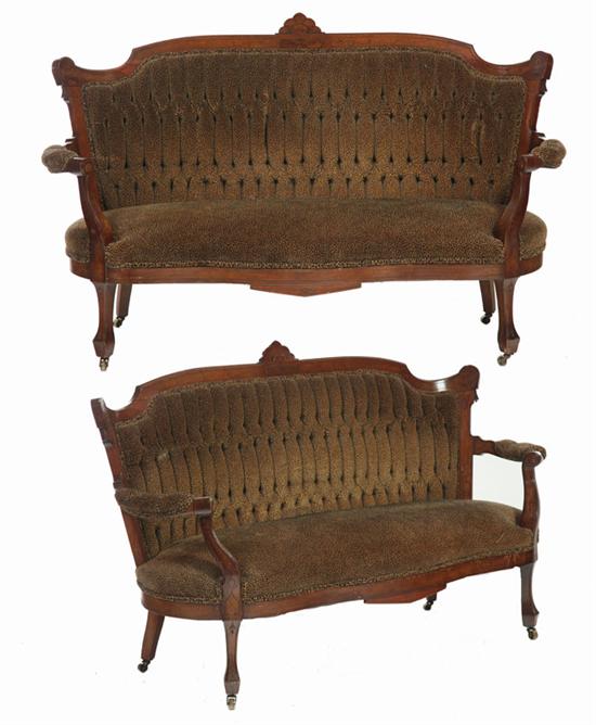 Appraisal: PAIR OF EASTLAKE VICTORIAN SOFAS American th century walnut Reupholstered