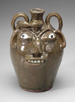 Appraisal: B B Craig face jug with snake medium olive glaze