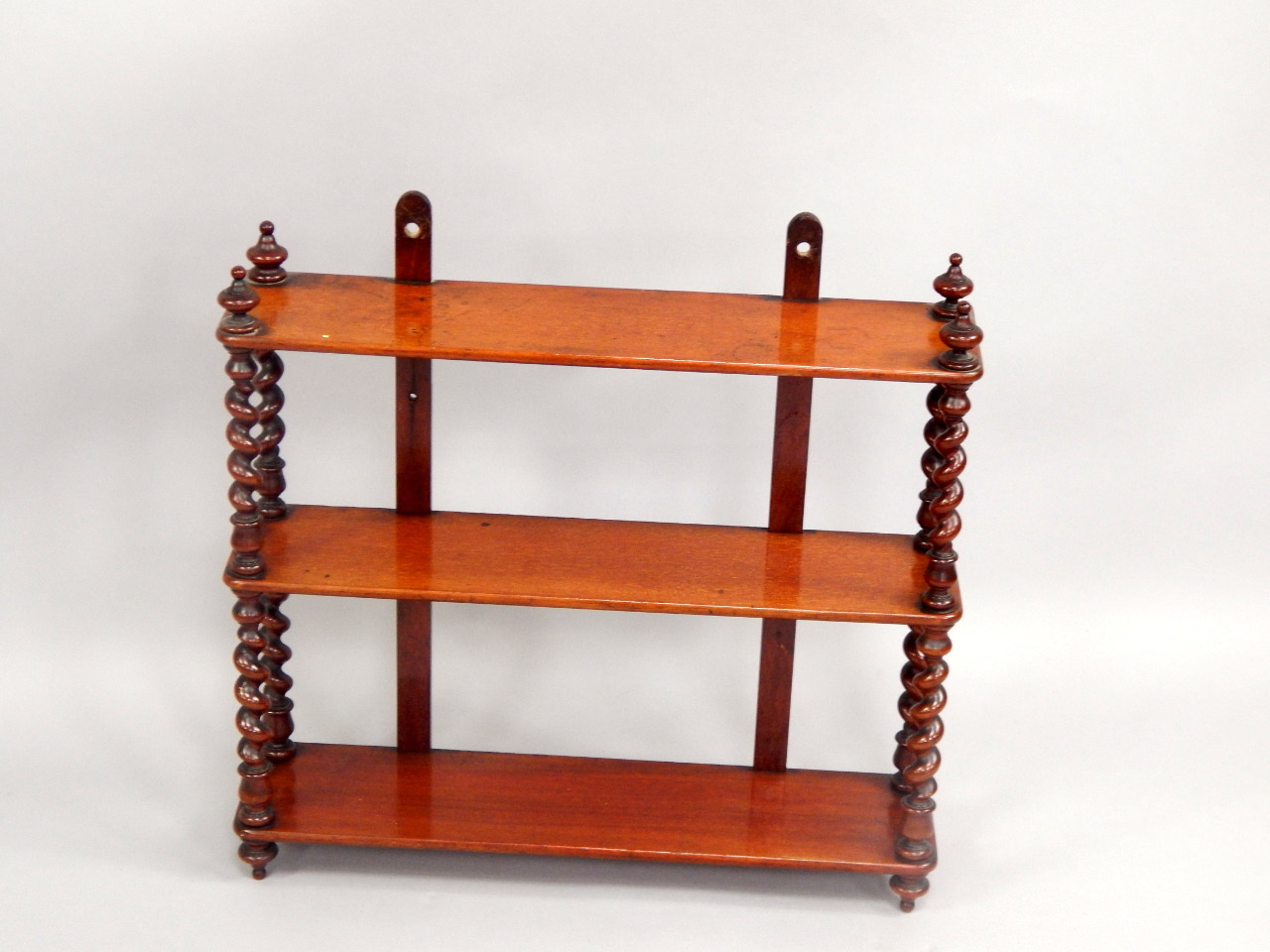 Appraisal: A late Victorian mahogany three tier hanging whatnot with spiral