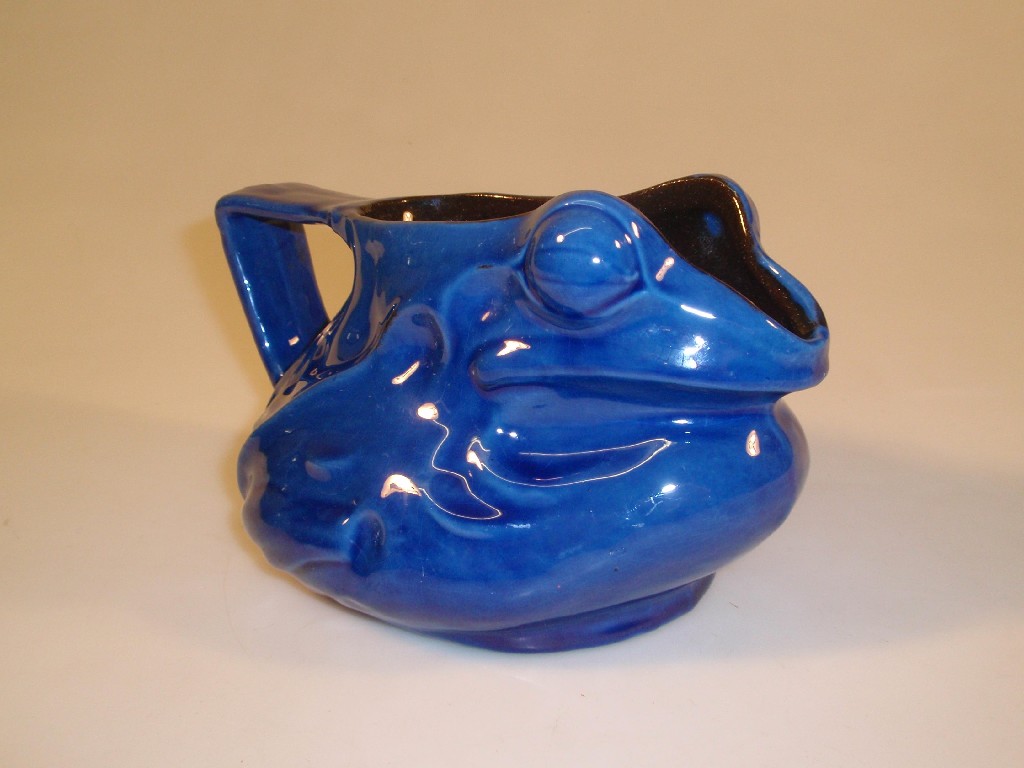 Appraisal: A Barnstaple pottery terracotta jug modelled as a bullfrog with