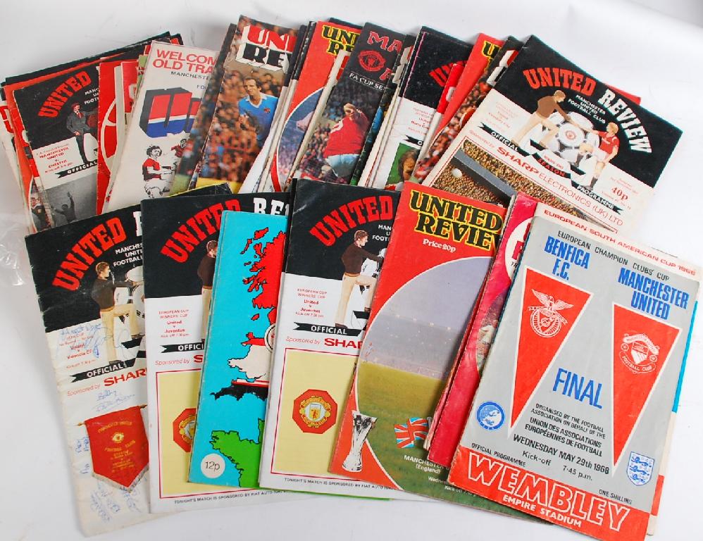 Appraisal: LARGE QUANTITY OF 'MANCHESTER UNITED REVIEW' FOOTBALL PROGRAMMES includes SEVEN