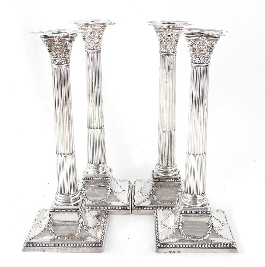 Appraisal: Rare George III sterling candlestick set London dated Corinthian stop-fluted