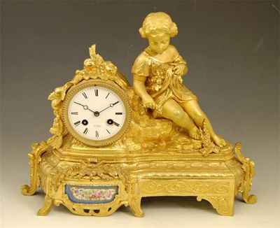 Appraisal: A th century French gilt brass mantel clock with an