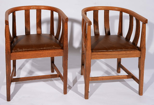 Appraisal: A pair of Gordon Russell oak armchairscirca each with horse-shoe