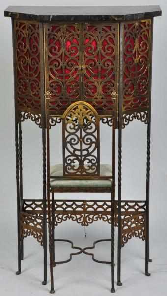 Appraisal: Oscar Bach Telephone Cabinet with Seat Circa Ornate metal table