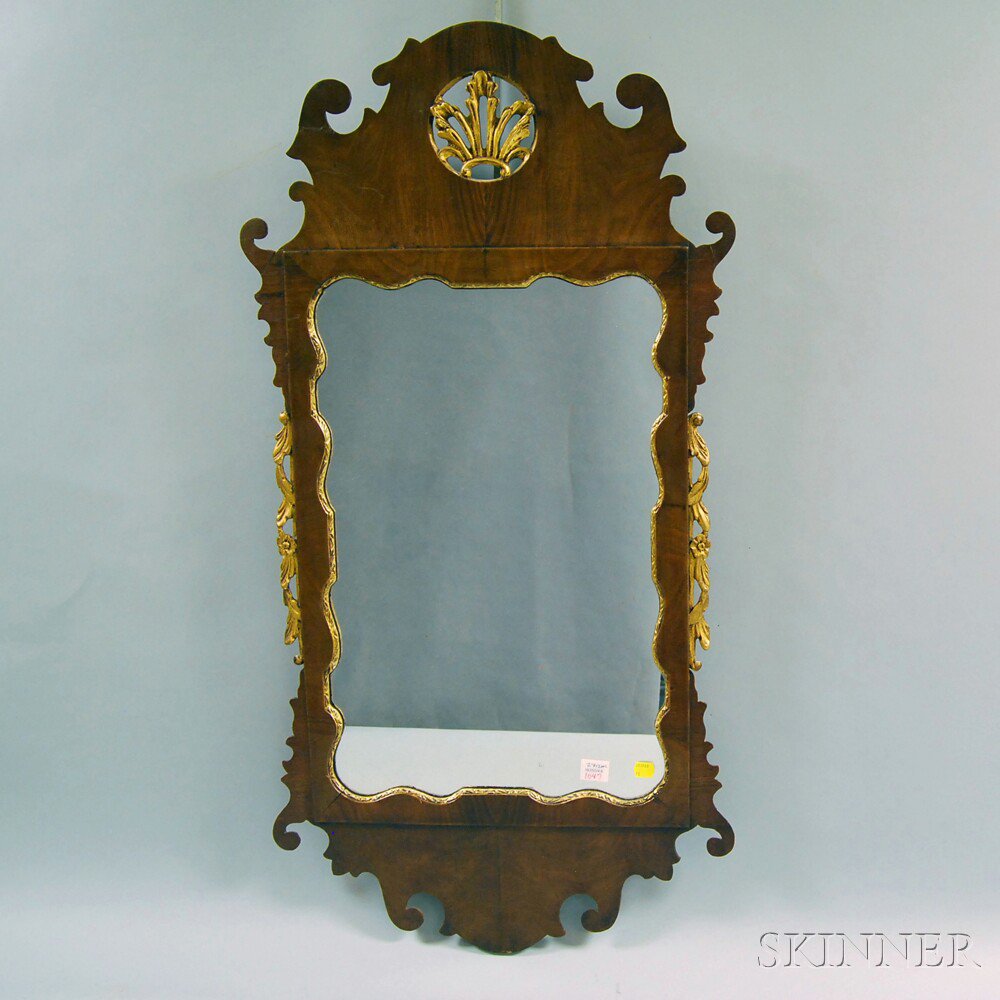 Appraisal: Chippendale-style Mahogany Veneer Scroll-frame Mirror the crest with pierced and