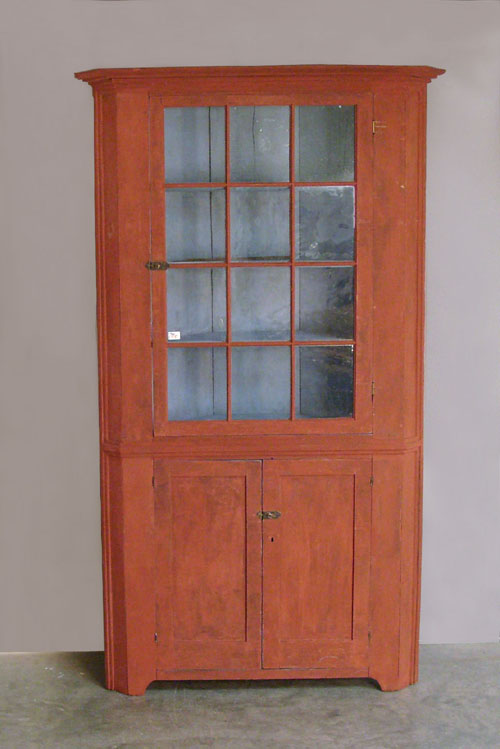 Appraisal: Red painted one piece corner cupboard th c h w