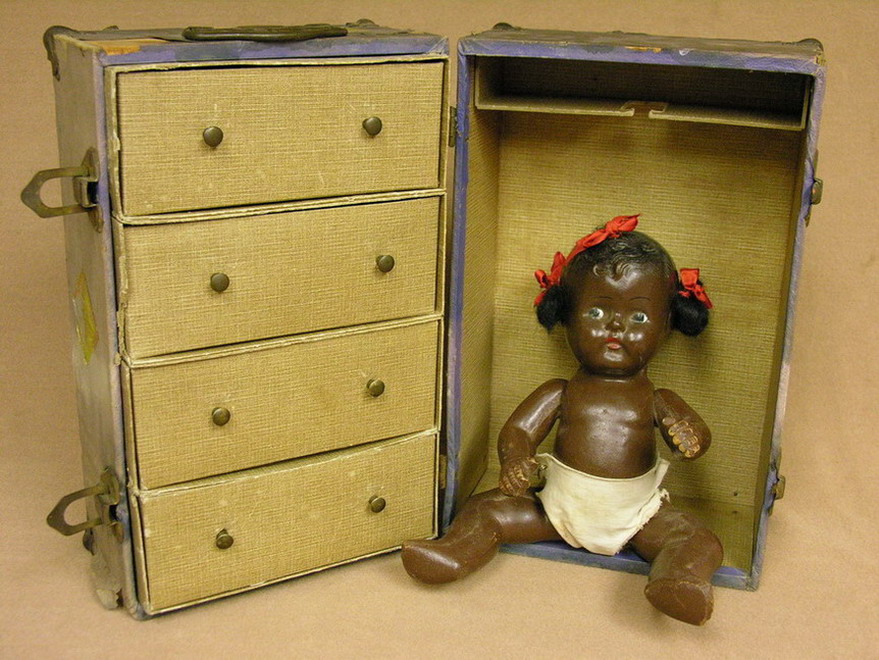 Appraisal: BLACK COMPOSITION DOLL AND TRUNK probably German some wear as