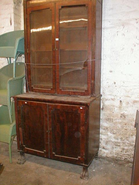 Appraisal: A Regency brass inlaid mahogany cabinet bookcase the upper part