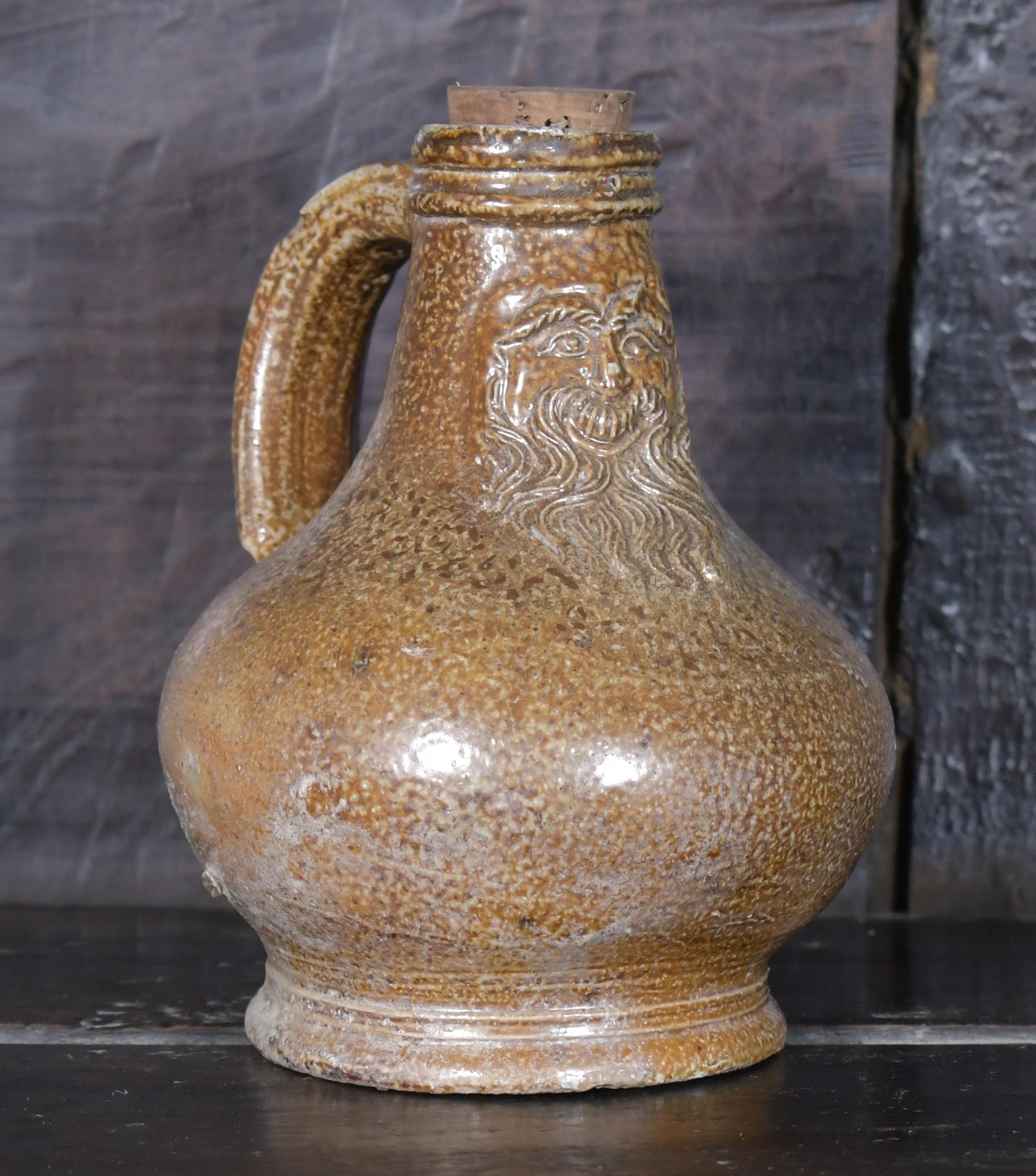 Appraisal: SMALL TH C BELLARMINE JUG A small salt glazed stoneware