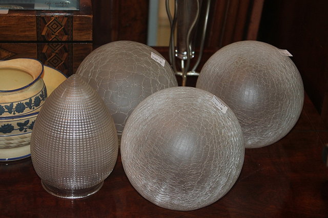 Appraisal: THREE GLASS CRACKED ICE GLOBE SHADES one other Edwardian shade