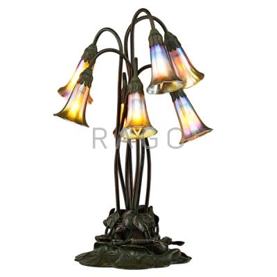 Appraisal: TIFFANY STUDIOS Seven-lily table lamp New York Favrile glass patinated