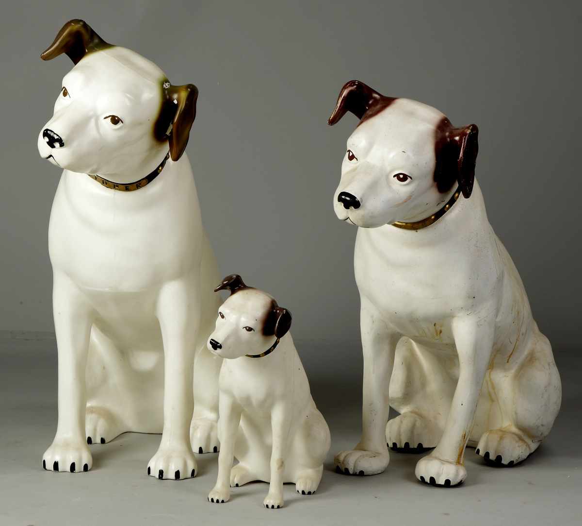 Appraisal: Three Victor Advertising Dogs composition hard plastic Dimensions Max Ht