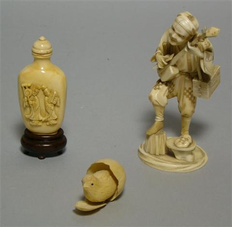 Appraisal: THREE ASIAN IVORIES The first Japanese carved as a chick