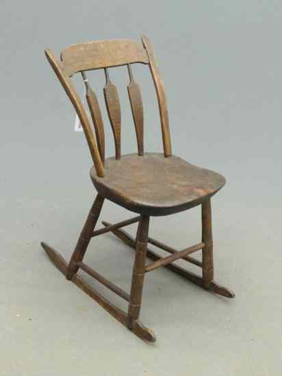 Appraisal: th c child' s arrowback rocking chair '' Overall Ht