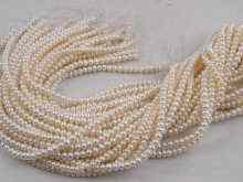 Appraisal: Thirty strings of freshwater button pearls each string approx cm