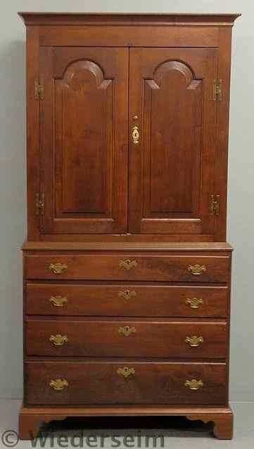 Appraisal: Chippendale style walnut two-piece linen press the upper section with