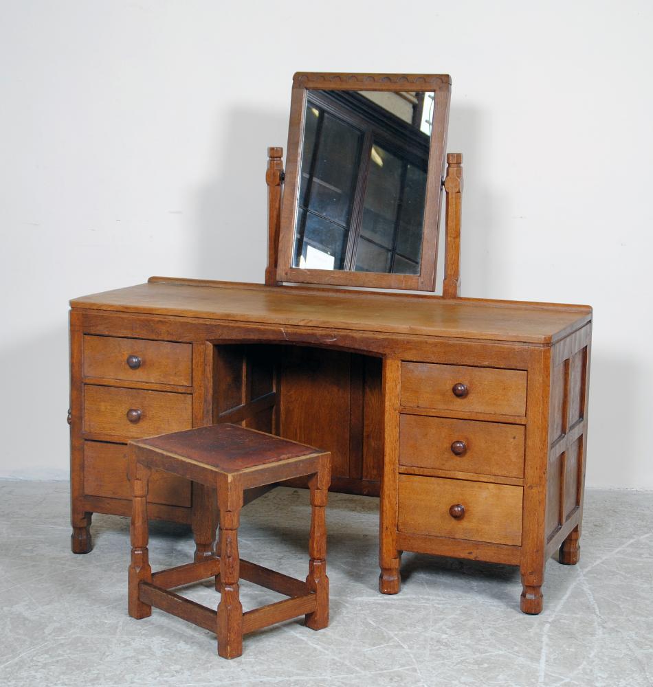 Appraisal: AN ADZED OAK DRESSING TABLE by Robert Mouseman Thompson 's