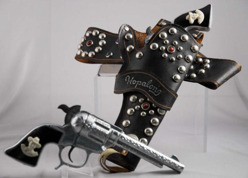 Appraisal: Hopalong Cassidy Double Holster Cap Gun Set Description Includes two