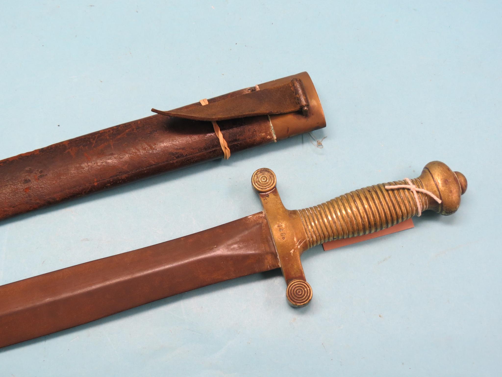 Appraisal: A French short-sword in straight double-edged blade cast brass grip