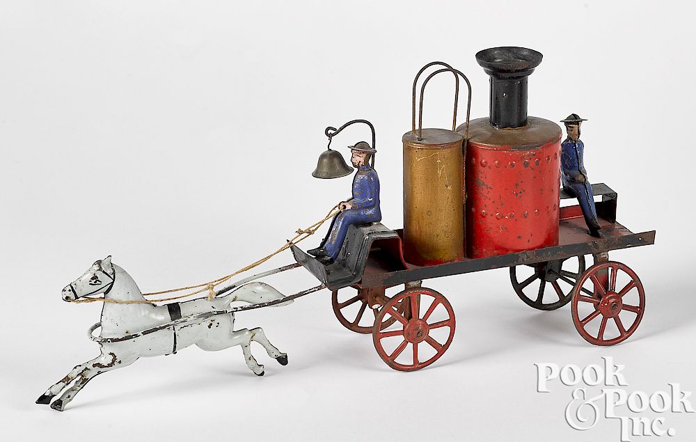 Appraisal: Early painted tin horse drawn fire pumper Early painted tin