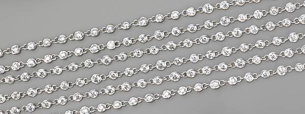 Appraisal: comprising round brilliant-cut diamonds completed by a cylindrical pav -set