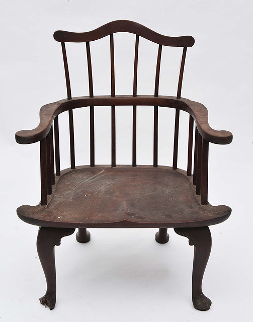 Appraisal: A GEORGIAN MAHOGANY WINDSOR ARMCHAIR with arching top rail to