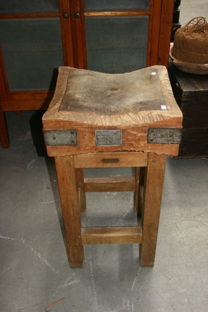 Appraisal: A pine butcher's block with a separate top a brass